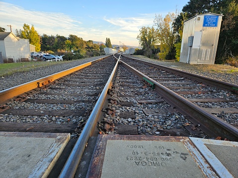 Line formation by train tracks in an intersection where the track will switch to another route in Napa California
