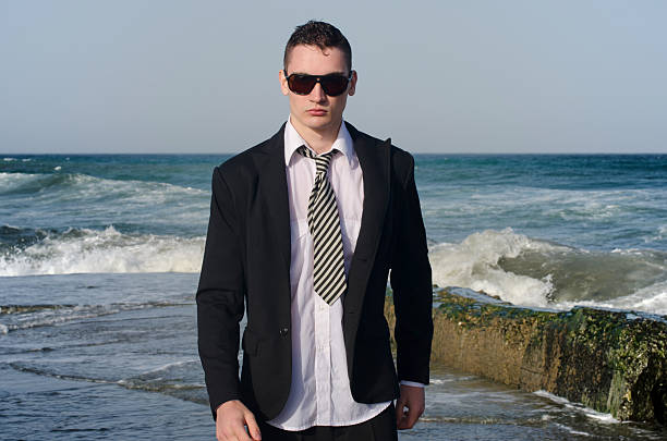 Young beautiful businessman enjoying his time on a beach