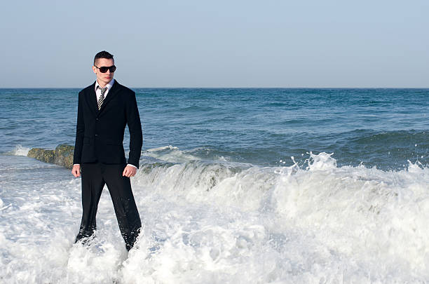 Young beautiful businessman enjoying his time on a beach