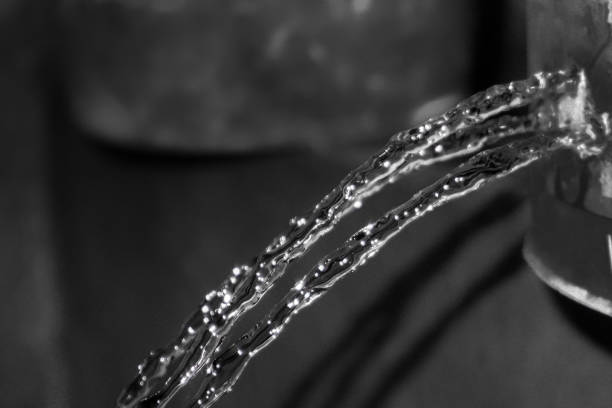 Closeup shiny stainless steel scratched sheet, abstract background with copy space, full frame horizontal composition