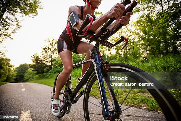 Cyclist Listening Music On Smart Phone Stock Photo - Download Image Now - Racing Bicycle, Women, Only Women