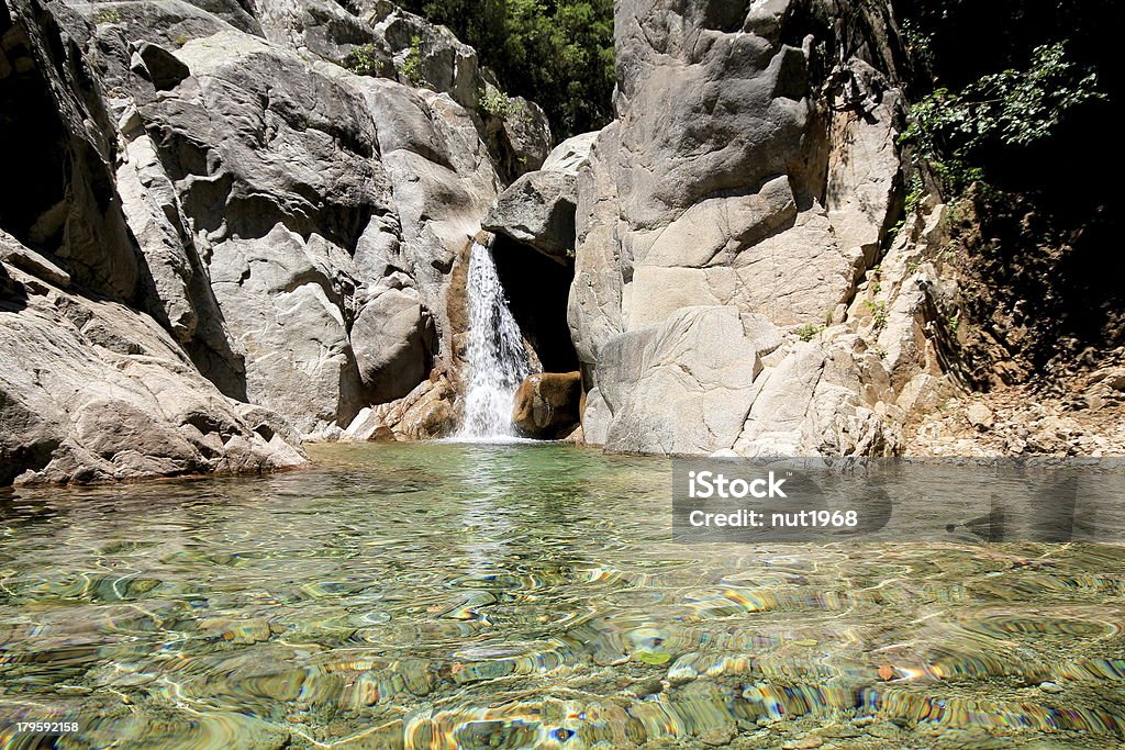 Solenzara, waterfall with a small lake view of a waterfall with a small lake in Solenzara Corsica Stock Photo