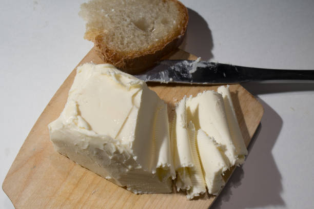 istock Cutting butter spread in sunlight shot close up 1795929891