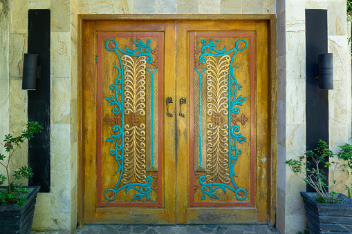 Sabang, Indonesia - June 01 2023: Pinto Aceh pattern. Famous traditional decoration and motif of aceh. Carved wooden door