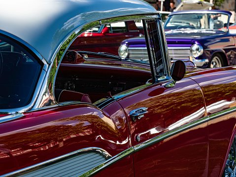 Isolated image of the headlights of a bright green American sports car