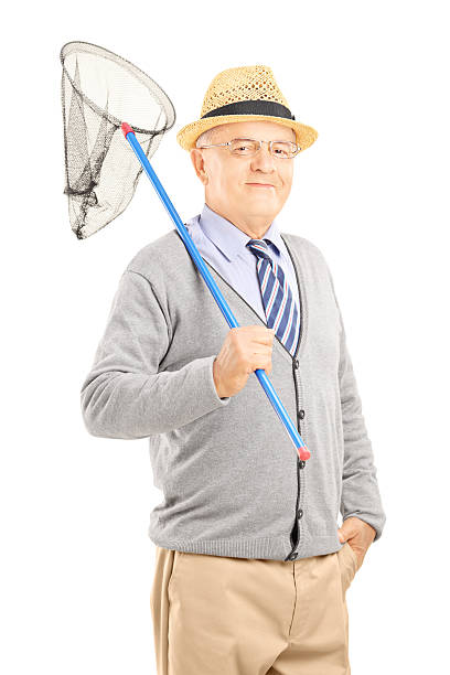 istock Smiling mature gentleman posing with a butterfly net 179598254