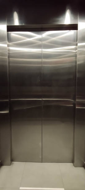istock medium-rise building lift stainless steel interior 1795990098