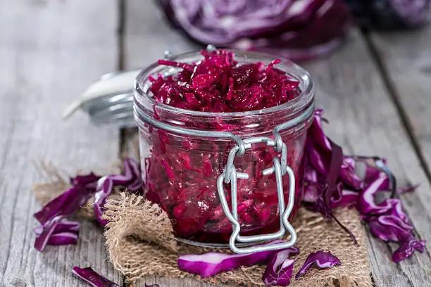 Fresh made portion of red Coleslaw on wooden background
