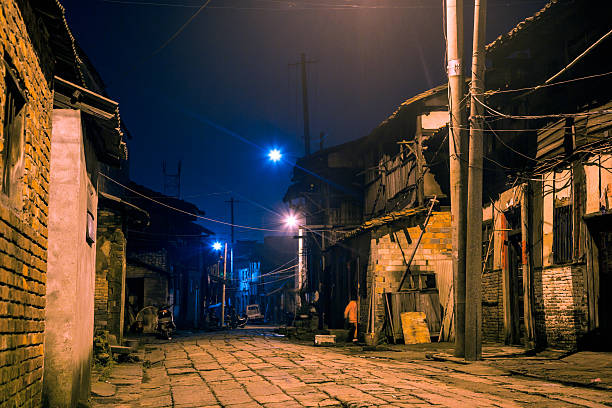 istock old alley at night 179602302