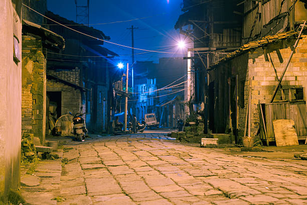 istock old alley at night 179602316