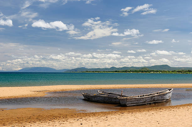 Lake Tanganyika, Tanzania Tanzania, Tanganyika lake is the Worlds longest and second deepest fresh water lake, it is also one of the oldest lakes on the planet. The picture presents beautiful sand beach manda stock pictures, royalty-free photos & images