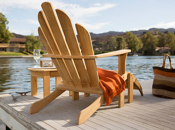 sedia adirondack sul lago - adirondack chair foto e immagini stock