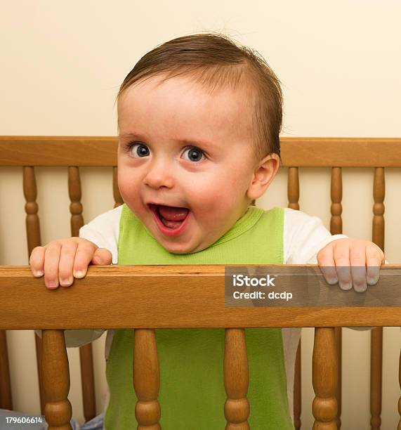 Very Happy Boy Standing In A Cot Stock Photo - Download Image Now - 12-23 Months, Babies Only, Bed - Furniture