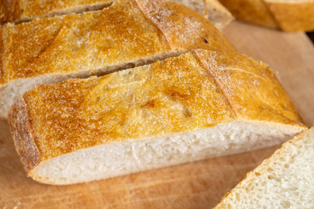 istock wheat loaf of bread close-up on the table 1796074196