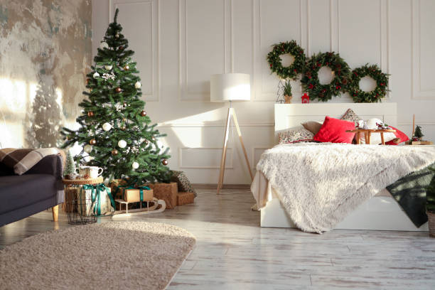 istock Bed with New Year's decorations. New Year's interior. Christmas tree 1796077016