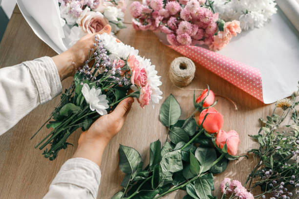 istock Florist at work. Woman making autumn floral decorations 1796077209