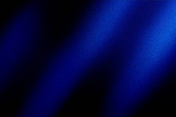 istock Silk satin fabric. Navy blue color. Abstract dark elegant background with space for design. Soft wavy folds. Drapery. Gradient. Light lines. Shiny. Shimmer. Glow. 1796113478