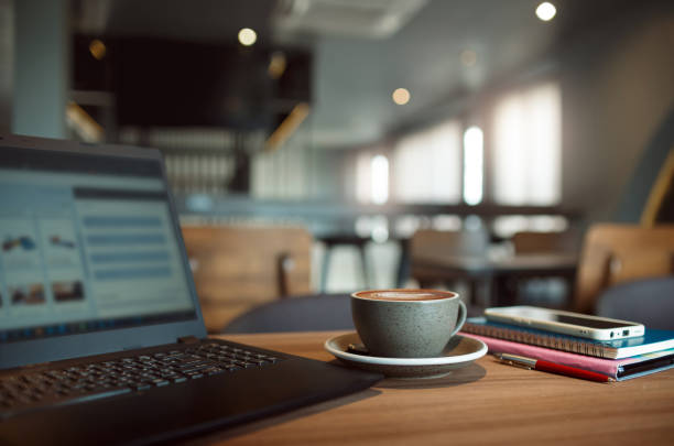 istock coffee drink and laptop on wooden table 1796122384
