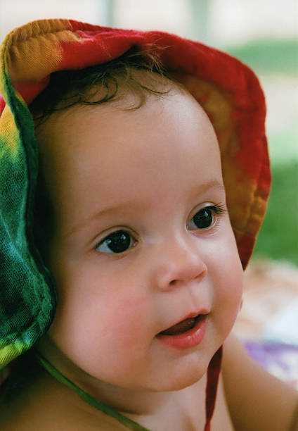 Close-up of beautiful baby Asian girl smiling.