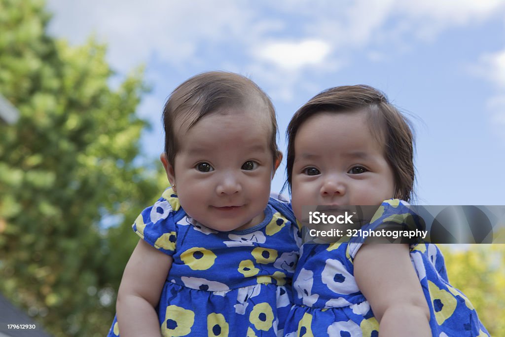 Fraternal Twin Sisters Mixed race twins Babies Only Stock Photo