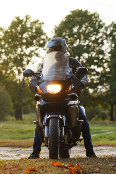 istock Vertical image. Unrecognizable person on motorcycle in nature in autumn during parking. 1796163368