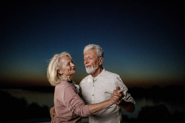 istock Romantic senior couple dancing at night. 1796164478