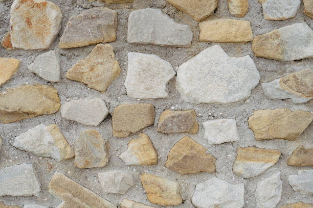 istock Stonework background. Wall made of stone and concrete 1796209433