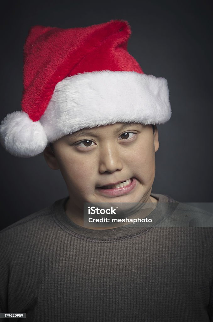 Feliz asiática usando un niño de Navidad Santa Hat - Foto de stock de Cara humana libre de derechos