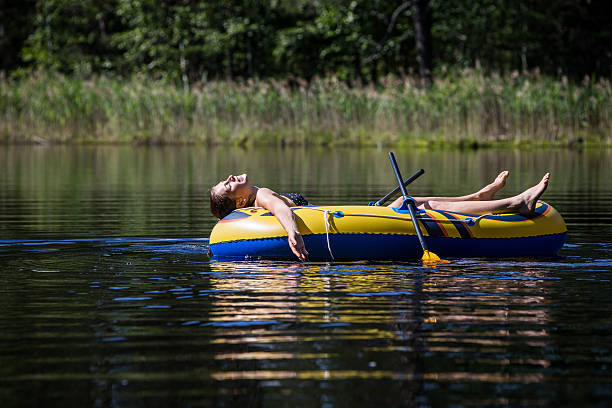 istock Woman sunbathing on a boat 179621060