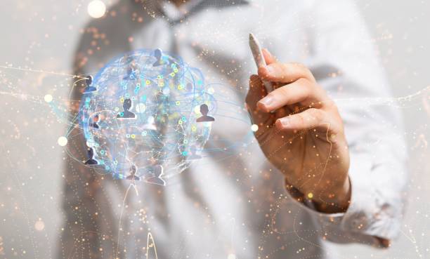 istock Hand with a pen pointing at a network with linked dots and profile icons 1796215742