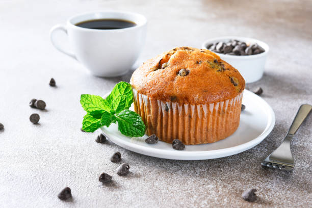istock Muffin with chocolate chips and a cup of coffee. Morning and breakfast time. 1796227272