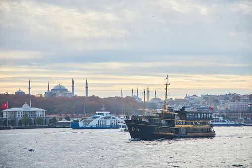 Istanbul, Turkey - November 23, 2021: The Bosphorus Strait. Pleasure boat at sunset