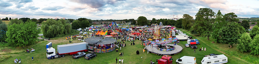 High Angle Panoramic View of a Funfair with Rides for Local Public of Luton City of England UK. The Funfair Was Held During Holidays to Celebrate Eid Festival of Muslim Community Who is Living at Luton Town of UK. The Funfair Was Held on June 29th, 2023