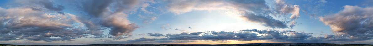 High Angle Ultra Wide Panoramic View of Sky and Clouds over North Luton Leagrave Town of England UK During Sunset of Mostly Cloudy Day.