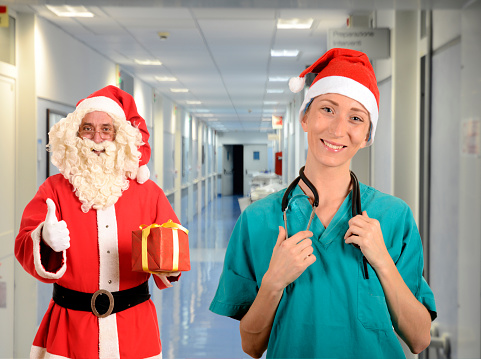 Santa Claus and young doctor in hospital
