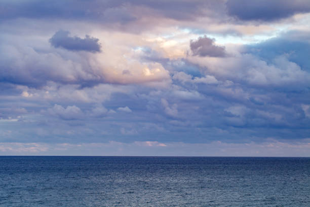 istock Sky in cloudy weather and sunset dark blue clouds on the sea, background 1796343378