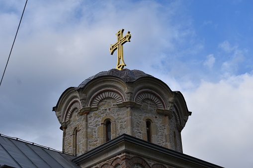 The resplendent cross on the church, a true crown jewel, shines brightly in Fruska Gora, inspiring awe and reverence
