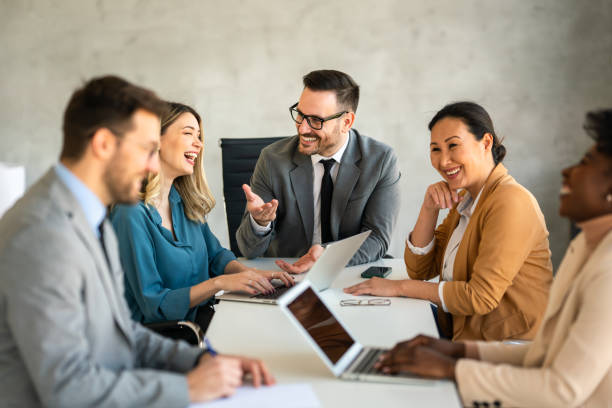 istock Multicultural professional businesspeople working together on research plan in boardroom. 1796351146