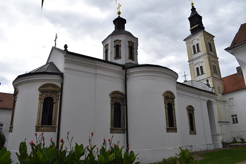 A glimpse of a historic Serbian monastery showcasing cultural richness amidst nature's abundant beauty