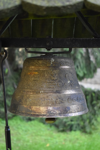 Small bell used for Buddhist ceremony on blur background