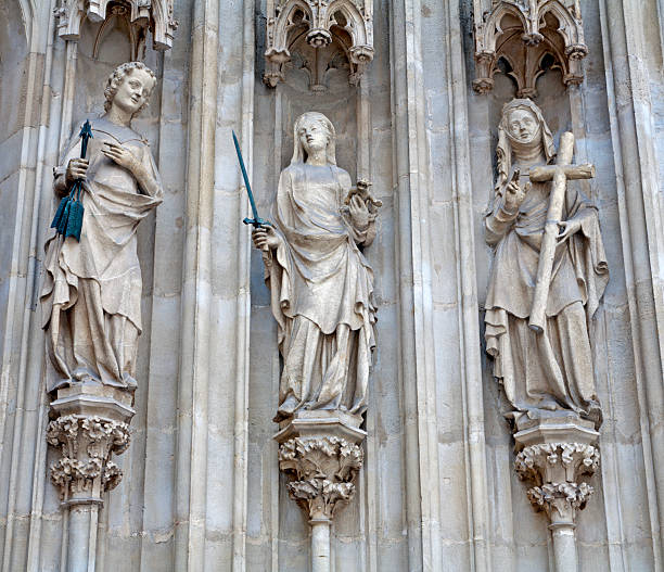 Vienna - Three cardinal virtues from west portal of Minoriten gothic church  on January 15, 2013 in Vienna.