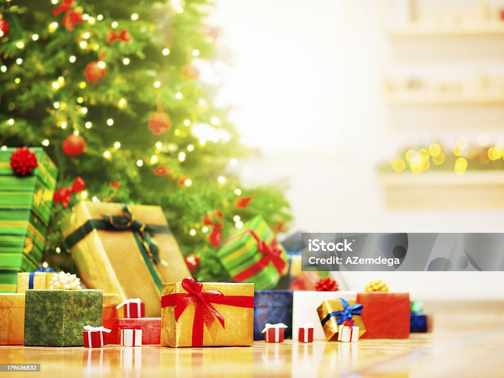 Christmas morning Christmas gifts under christmas tree in the sunny morning. Advent Stock Photo