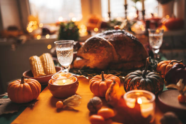 istock Thanksgiving holiday dinner table setting with fall decoration and pumpkins 1796376233