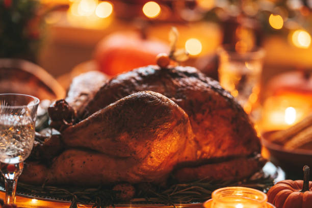 istock Thanksgiving holiday dinner table setting with fall decoration and pumpkins 1796376247