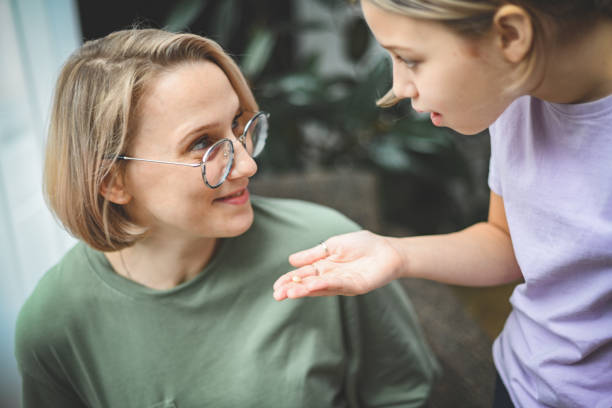istock daughter shows mom a lost tooth 1796387437
