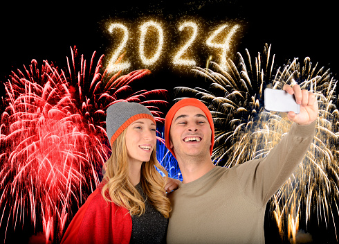 Young couple and new year fireworks