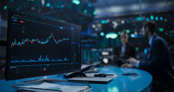 Close Up on a Computer Screen with Real-Time Stock Market Analytics, Graphs and Reports. Stock Exchange Software Template. Brokers Discussing Financial and Business Opportunities in the Background Close Up on a Computer Screen with Real-Time Stock Market Analytics, Graphs and Reports. Stock Exchange Software Template. Brokers Discussing Financial and Business Opportunities in the Background stock stock pictures, royalty-free photos & images