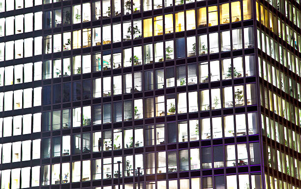 istock facade of office building by night 179640436