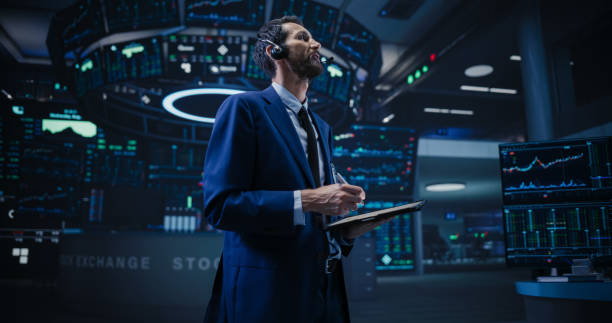 istock Productive Stock Exchange Broker Working on a Tablet Computer, Manipulating Company Shares, Valuable Technology Investments, Public and Private Securities. Low Angle Action Shot 1796405540