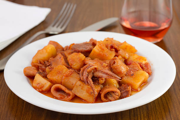 istock squid with potato and tomato sauce on the plate 179640834